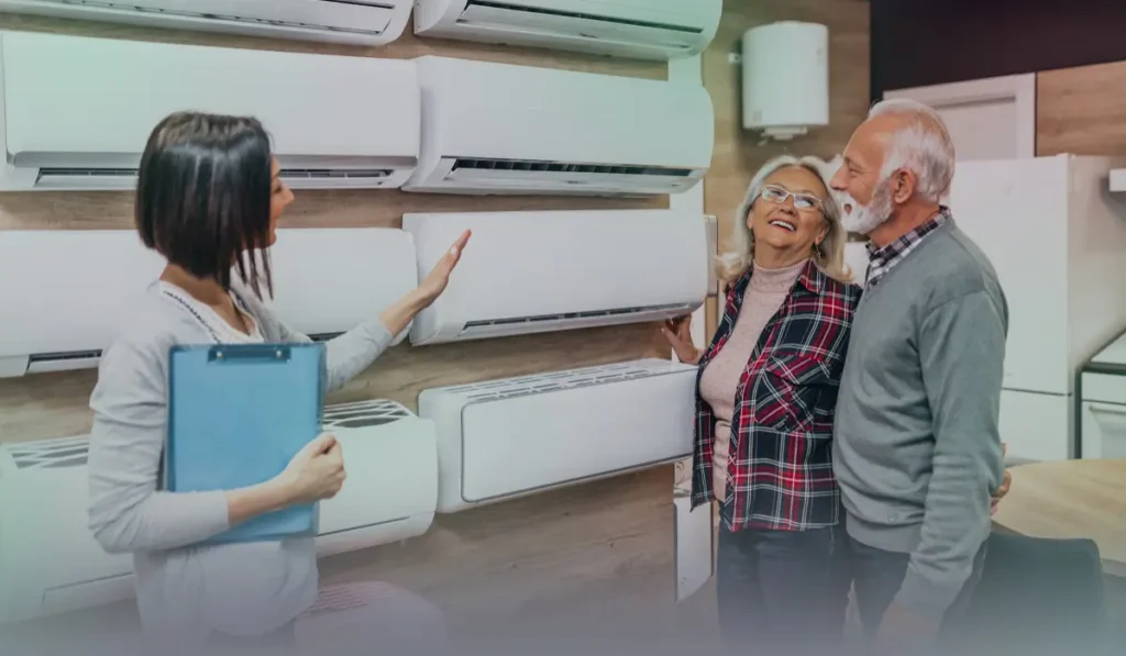 Elderly couple buying an air conditioner with guidance from an expert Title: Elderly Couple Guided by Expert to Buy an Air Conditioner